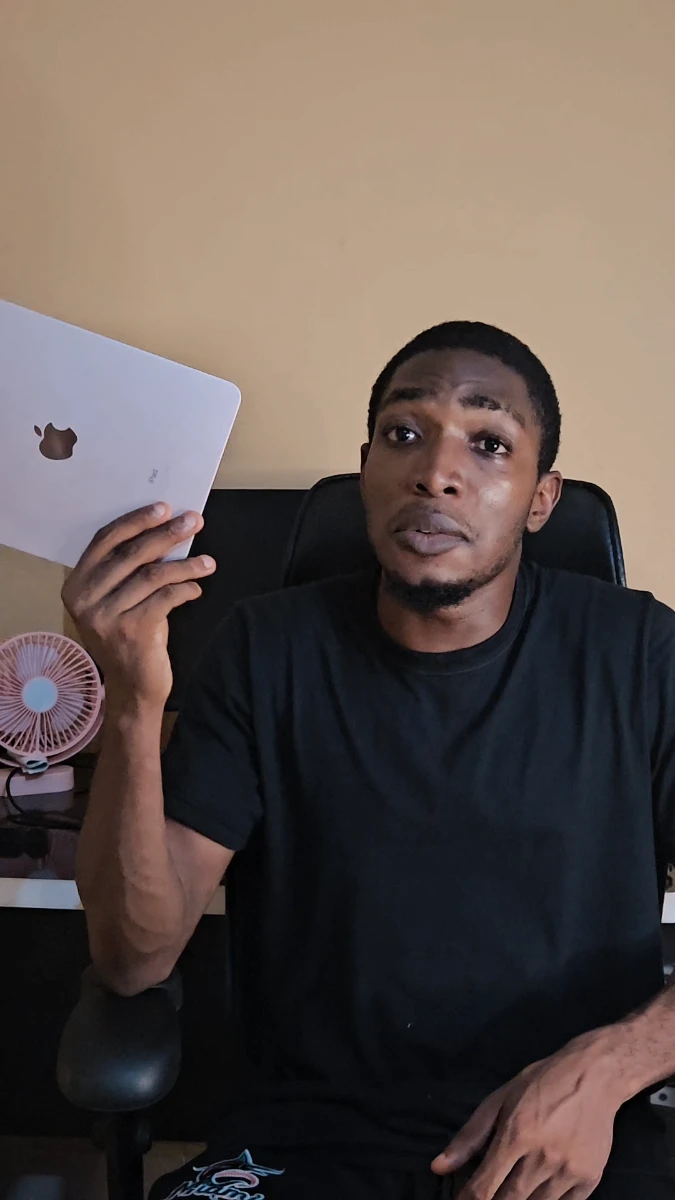 Chiaza holding a tablet